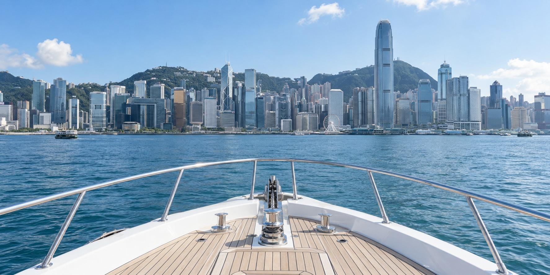 Yacht deck looking across Victoria Harbour toward the Hong Kong skyline